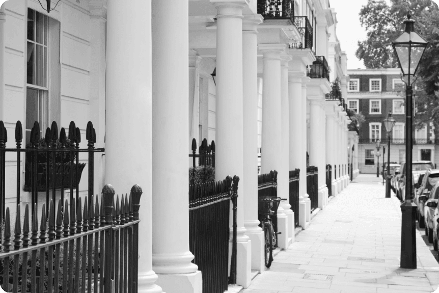 EMsculpt NEO body sculpting London - black and white photo of a white stucco terrace Black and white photo of a white stucco terrace street for EMsculpt NEO body sculpting in London